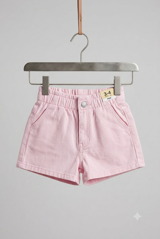 Girls pink denim shorts on hanger